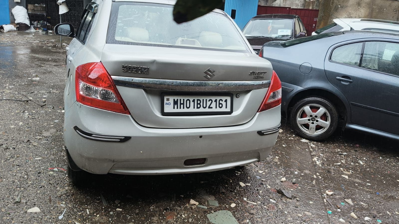 Maruti Suzuki Swift Dzire parked at Siddhi Automobiles for inspection